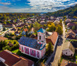Tokaj, Hungary - Aerial view of the Saint Nicholas Orthodox church at the high street of the town of Tokaj on a sunny autumn morning with blue sky and clouds