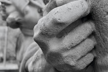 Close Up Shots Of Gripping Hands In A Historic Group Of Public Sculptures In Cardiff. The Carved Hands Of The Miners Are Large, Strong And Taut With Effort  Pushing And Pulling The Heavy Containers
