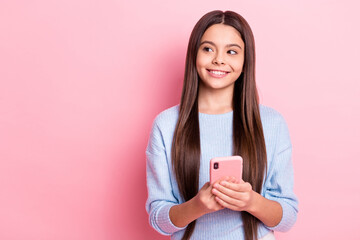 Canvas Print - Portrait of attractive cheerful girl using device creating post smm idea isolated over pink pastel color background