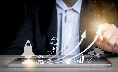business start up with rocket launching concept. businessman touch on screen and icon target, idea, 