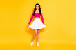 © deagreez - Full length photo of young attractive girl happy positive smile wear casual outfit isolated over yellow color background