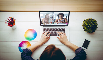 Sticker - Caucasian businesswoman sitting at desk using laptop having video call with colleagues