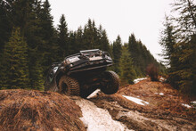 Offroad Car Jump In The Mountains. Pollen, Swamp And Snow. Affortation, Suspension, Tires