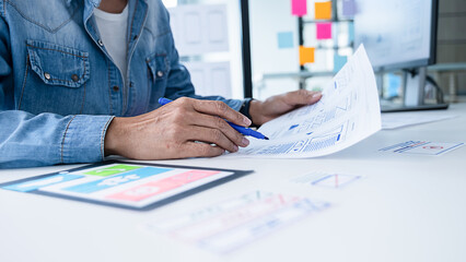 Wall Mural - creative web designer planning application and developing template layout, framework for mobile phon