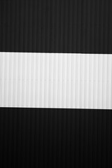 Wall Mural - Black and white corrugated iron sheet used as a facade of a warehouse or factory. Texture of a seamless corrugated zinc sheet metal aluminum facade. Architecture. Metal texture.