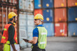 © chokniti - worker teamwork and partner of foreman, engineer, and businessman working in an international shipping area, concept of business industrial and working in container yard.