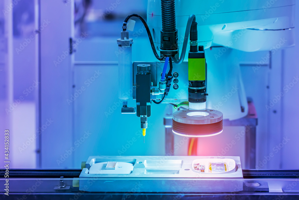 Robot holding glue syringe Injection with robotic machine vision system ...