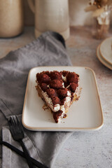 Sticker - Vertical shot of delicious Bonafi Cream Pie slice with chocolate powder on a white plate with forks