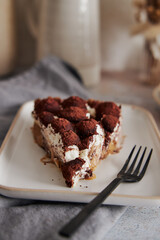 Sticker - Vertical shot of delicious Bonafi Cream Pie slice with chocolate powder on a white plate with a fork