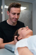 © Enrique Espinosa/ADDICTIVE STOCK - Unshaven male physical therapist massaging neck of woman with closed eyes in hospital