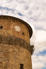 Wall Mural - Closeup of an ancient medieval tower with clock, Tuscany, Italy.