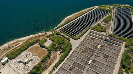 Aerial drone photo of latest technology sewage and sludge processing plant in small island of Psitalia or Psyttaleia, Piraeus, Attica, Greece