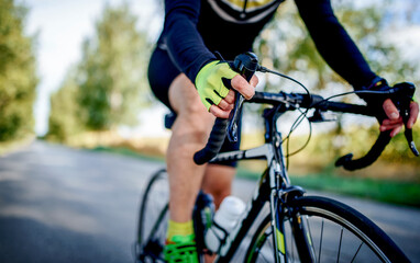 Cyclist riding a bicycle, close up photo. Sport and recreation concept