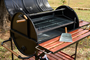 Wall Mural - excellent portable barbecue made by hand in black.