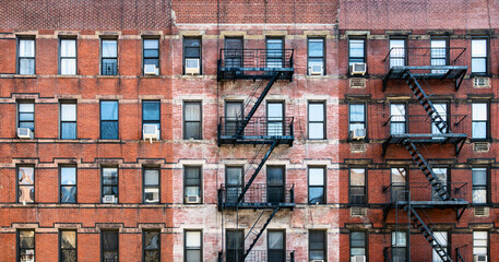 Wall Mural - Old brick apartment buildings with windows and fire escapes along Second Avenue in the Upper West Side of Manhattan, New York City NYC