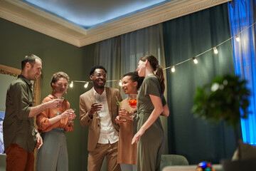 Wall Mural - Waist up portrait of diverse group of friends having fun at indoor party at home, copy space