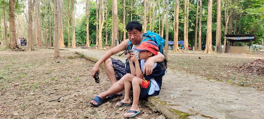 parent and child in the national park of leisure summer holidays.