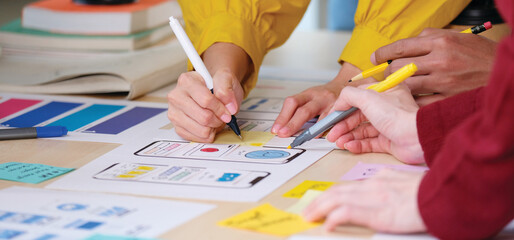 Wall Mural - brainstorm planing creative teamwork, close up of hands mobile phone app developer team meeting abou