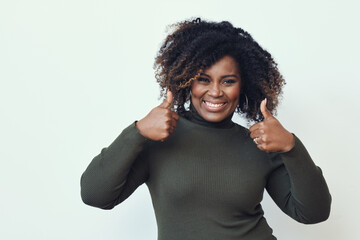 Wall Mural - Happy African American black woman with curly hair Showing Thumbs Up