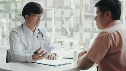 Wall Mural - Doctor talking patient history list on note pad and talking to the patient about medication and treatment.