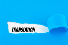 Text Translation Appearing Behind Ripped Blue Paper.