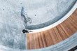 © AmazingAerialAgency - Aerial view of BMX bike rider doing wheelie in central city square in Panevezys, Lithuania.