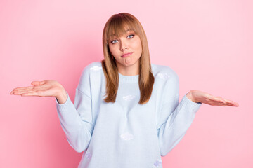 Poster - Portrait of attractive unsure girl shrugging shoulders dont know isolated over pink pastel color background