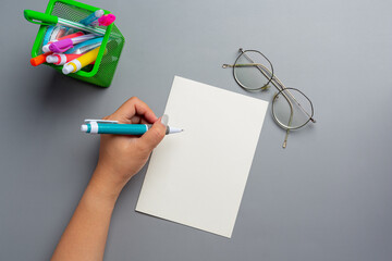 a woman left-hand with a pen.Left hander day concept.