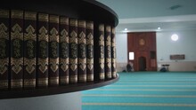 Close-up Of Qurans In A Row On Shelf