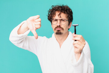 Poster - young crazy man shaving his beard with a razor