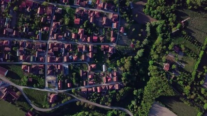 Sticker - A 4k rendering of a village with cultivated agricultural fields near the river