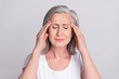 Photo of senior woman hands touch head ache pain suffer ill migraine sick isolated over grey color background