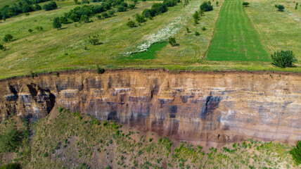 Wall Mural - limestone cliffs from the old volcano and green vegetation in the middle of the plain