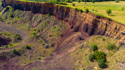 Wall Mural - limestone cliffs from the old volcano and green vegetation in the middle of the plain