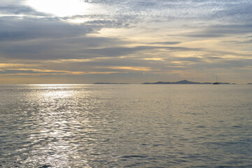 Sunset with cloudy sky and sea overlooking the island, Beautiful dramatic cloudscape, Cloudy sky background.