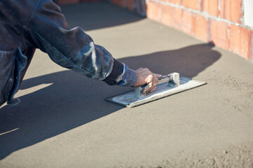 Wall Mural - Real construction worker working on a house renovation - authentic person on the job.