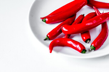 Canvas Print - chili food with red pepper in plate on white background