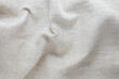 texture of crumpled natural linen fabric of gray color close-up. background for your mockup