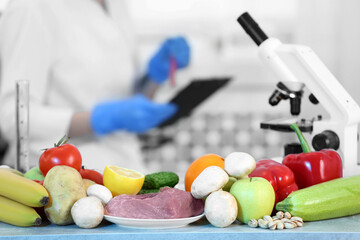 Wall Mural - fresh vegetables, fruits and meat on table in laboratory. food quality control