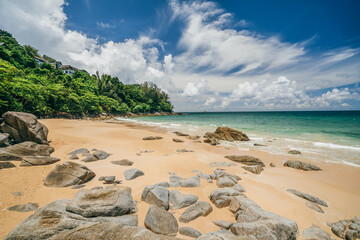 Beautiful tropical beach sea and sand with green jungle forest on hill on blue sky and white cloud for travel and vacation