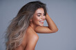 © Kalim - Beautiful adult woman portrait. Studio shot, isolated on gray background