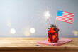 © maglara - Happy Independence Day, 4th of July celebration concept with summer fruit drink and USA flag on wooden table