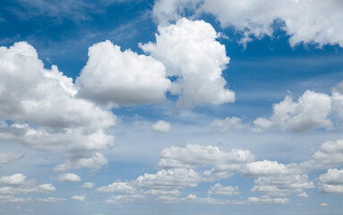 Wall Mural - white, fluffy clouds in blue sky. background from clouds