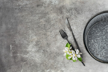 Wall Mural - Plase table setting with blossoming apple tree branches and flowers