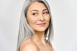 © insta_photos - Middle aged happy mature asian woman, senior 50 year lady looking away, isolated on white closeup headshot. Ads of antiaging uv protection whitening menopause dry skincare, plastic surgery.