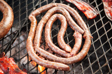 Traditional South African Boerwors Sausage Cooks On A Braai, Or South African Barbecue..  Durban South Africa.