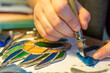 cutting stained glass with a glass cutter, glass scraps