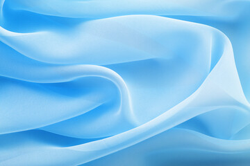 Wall Mural - light blue fabric draped with wavy folds, textile background