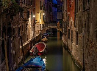 Fototapete - Narrow canal with bridge in Venice, Italy. Architecture and landmark of Venice. Night cozy cityscape of Venice.