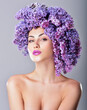 © Svetlana Fedoseeva - Beauty fashion model Girl with Lilac Flowers Hair Style. Nature Hairstyle. Summer. Professional makeup.